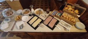 a table with some food on top of it at Residencial Do Rita em Rio Caldo in Geres
