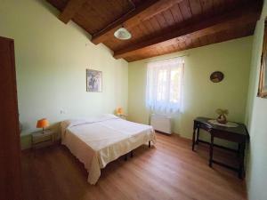 Ένα ή περισσότερα κρεβάτια σε δωμάτιο στο La Casetta al Sole