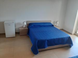 Postel nebo postele na pokoji v ubytování Liberi di Sognare