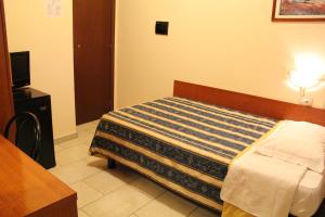 Posteľ alebo postele v izbe v ubytovaní Hotel Alessander