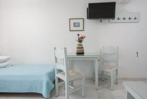 TV a/nebo společenská místnost v ubytování Castello studios