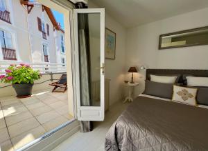 Posteľ alebo postele v izbe v ubytovaní 120m2 avec deux terrasses ensoleillées à Biarritz
