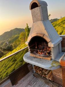 a brick oven with a fire inside of it at LOVA BUNGALOV in Ardeşen