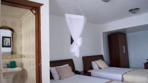 Voodi või voodid majutusasutuse Océanis Hotel toas