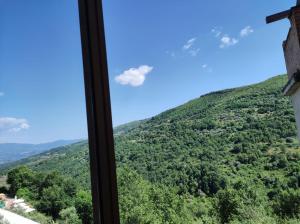 a view of a mountain from a window at Le DueLamie in Sessa Cilento