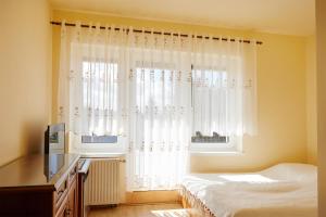 Postel nebo postele na pokoji v ubytování Dom na Wzgórzu