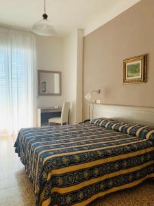 Ένα ή περισσότερα κρεβάτια σε δωμάτιο στο Grand Hotel Vallombrosa