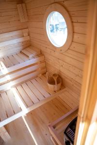 an inside view of a wooden sauna with a window at Ferien an der Eiche in Schermbeck