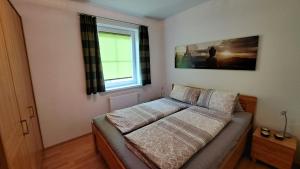 Łóżko lub łóżka w pokoju w obiekcie Appartement Zirkl / Haus Gloria
