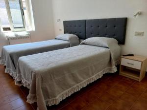 Krevet ili kreveti u jedinici u okviru objekta La Casa di Nonna Romina