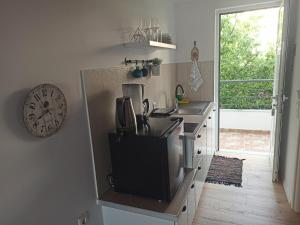 A kitchen or kitchenette at Bourbos Summer Rooms