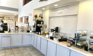 a kitchen with stainless steel appliances and a stove top oven at North Shore Inn at Lake Mead in Moapa Valley
