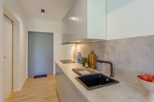 Kuchyň nebo kuchyňský kout v ubytování Apartament Morski Piasek + 20 fotografií