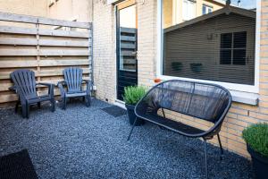 two chairs and a table on a patio at Studio Puuur in Zandvoort