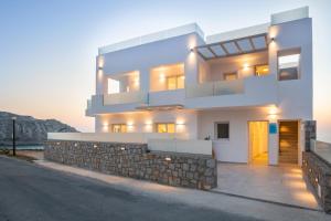 a house with a view of the ocean at Thalasidi Luxury Suites in Karpathos Town