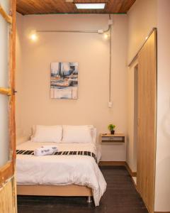 A bed or beds in a room at The Luun Hostel