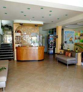 a lobby of a store with a counter in the middle at Costa del Sole Only Room in Milano Marittima