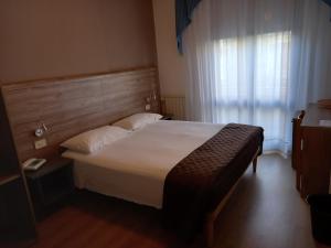 Postel nebo postele na pokoji v ubytování Hotel Lory My Wellness SPA