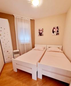 Postel nebo postele na pokoji v ubytování Apartment Iva