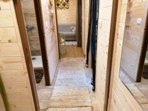 a hallway leading into a tiny house at Planinski Dom na Travni Gori in Sodražica +82 photos