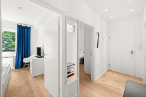 a white room with a door to a bedroom at Apartment near Volksoper - Modern, Big, Central, Cosy in Vienna