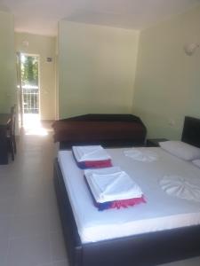 Postel nebo postele na pokoji v ubytování Hotel Maria