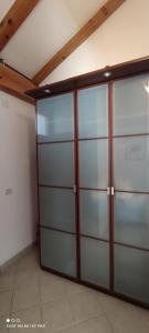 a garage with two sliding doors in a room at Apartment Višnja in Vodice