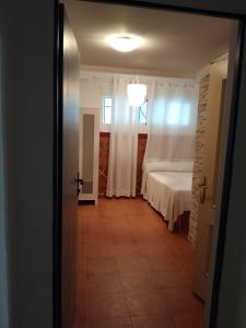Postel nebo postele na pokoji v ubytování Joy Beach B&B