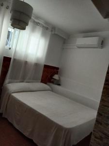 Postel nebo postele na pokoji v ubytování Joy Beach B&B