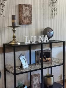 a black shelf with a hui sign on top of it at Pension Restaurant Luna in Treis-Karden