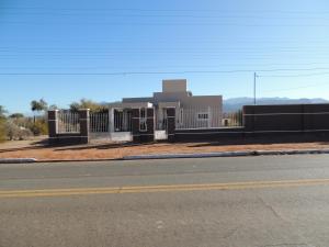 a building on the side of a street with a road at Casa Quinta in Villa Unión