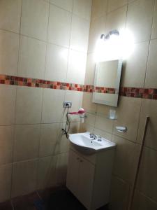 a bathroom with a sink and a mirror at Casa Quinta in Villa Unión +16 photos