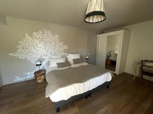 Postel nebo postele na pokoji v ubytování La Maison de l'Olivier