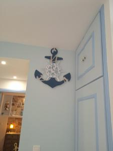 a room with a anchor on the wall next to a door at Artistic house in Kokkari