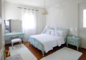 Postel nebo postele na pokoji v ubytování Anax Villa
