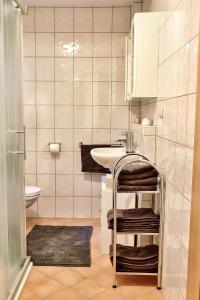 a small bathroom with a sink and a toilet at Ferienhaus Possath in Leutschach