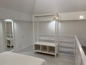 A bed or beds in a room at Loft EL DUQUE
