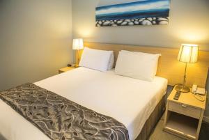 Uma cama ou camas num quarto em Waves