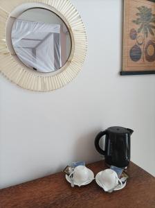 a mirror sitting on top of a wooden table at Zanzicrown in Nungwi
