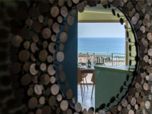 a view of the ocean from a mirror at Villa LeA in Imperia