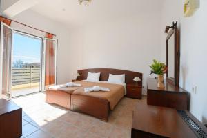 Postel nebo postele na pokoji v ubytování Hotel Akti Arilla