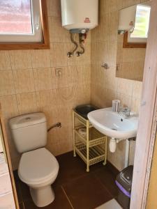 a bathroom with a toilet and a sink at u Anny Pionierów 8B in Mielno +16 photos