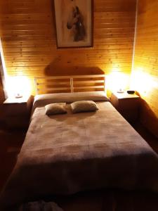 Postel nebo postele na pokoji v ubytování La Cabaña