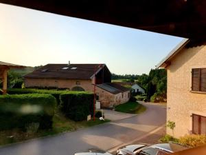 a view of a house and a street at Les Vergers d'Epona "Fremifontaine VOSGES" in Frémifontaine