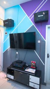 A television and/or entertainment centre at Villa Aviation by Masterpiece Villa