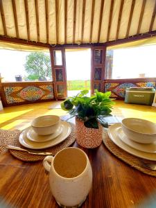 a table with plates and a cup of coffee on it at The Kites Rest at Castle Creavie Farm in Kirkcudbright