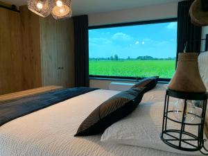 Postel nebo postele na pokoji v ubytování Vakantiewoning 't Rysselhof