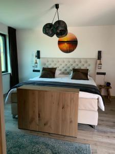 Postel nebo postele na pokoji v ubytování Vakantiewoning 't Rysselhof
