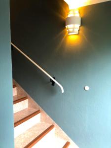 a light on a wall next to some stairs at Ferienhaus Mautzfried in Reisach