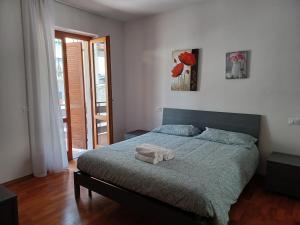 Postel nebo postele na pokoji v ubytování Ledro Lake Apartment